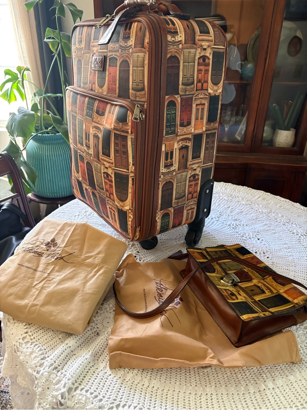 Printed Rolling Carry-On Suitcase in Brown and crossbody bag.  Price firm.